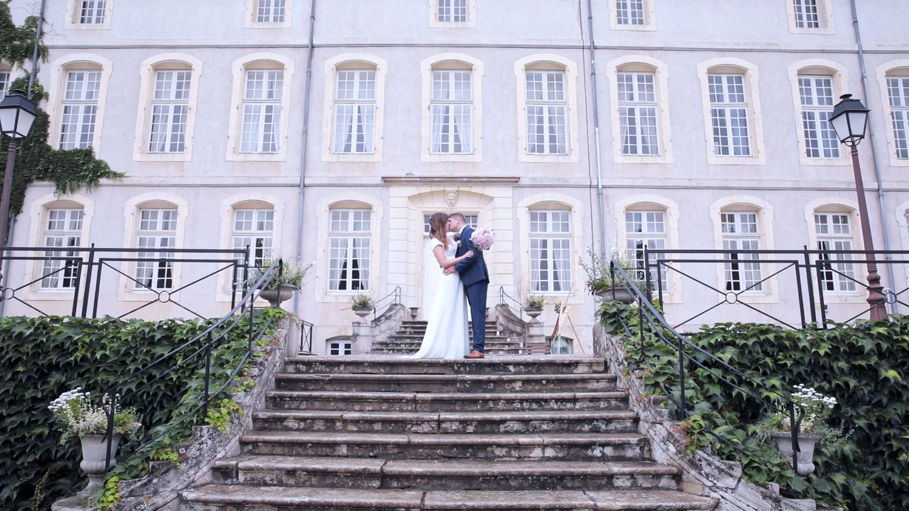 Marie-Agnès and Thomas in front of their wedding venue